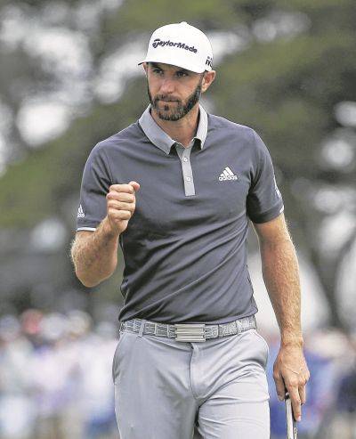 Dustin Johnson reacts after making a birdie putt on the fourth green during Friday’s second round of the U.S. Open in Southampton N.Y. AP