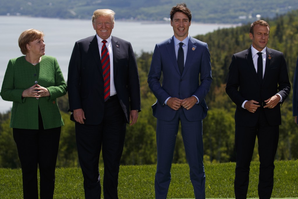 German Chancellor Angela Merkel President Donald Trump Canadian Prime Minister Justin Trudeau and French President Emmanuel Macron gather for the