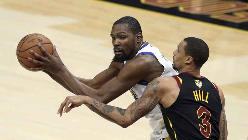 Golden State Warriors Kevin Durant is defended by Cleveland Cavaliers George Hill during the second half of Game 3 of basketball's NBA Finals Wednesday