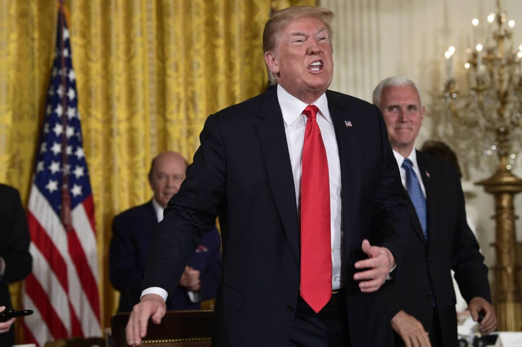 President Donald Trump speaks as he stands up after signing a space policy directive during a National Space Council meeting in the East Room of the White House in Washington Monday