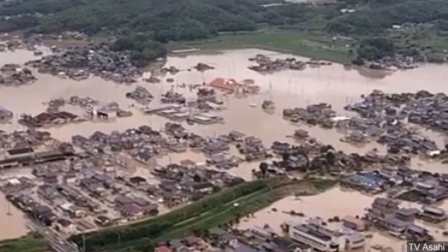 Japan floods leave at least 64 people dead and scores missing