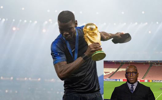 Manchester United midfielder Paul Pogba pauses with the World Cup trophy and Ian Wright