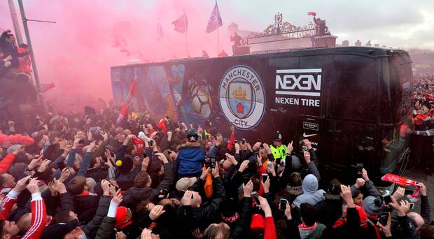 Sorry sight Manchester City's team bus comes under fire from Liverpool fans in April