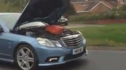 A Motorist Caught On Camera Driving With Hood Up