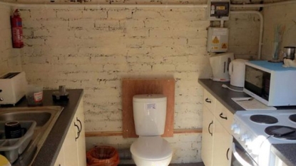 A standard home in which toilet is fixed in between kitchen: council ordered to demolish it