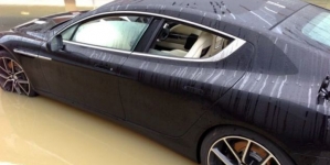 Man proves that you can’t drive over street flood even with your luxurious car