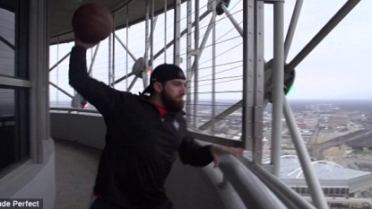 Watch how to drop the basketball from a 561ft tower into a moving net