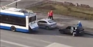 Bus towing a car leads to a crash with another parked vehicle