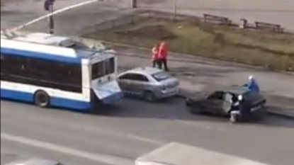 Bus towing a car leads to a crash with another parked vehicle