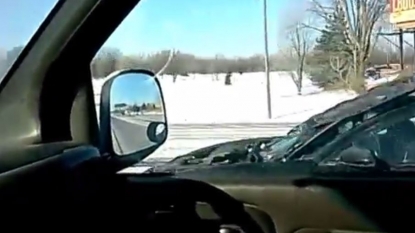 A foolish driver driving car with open bonnet