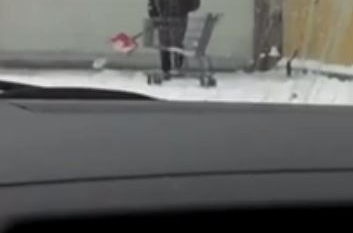 Stupid worker collecting snows in a trolley