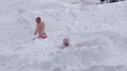 Two bored friends explains, how to swim in snow