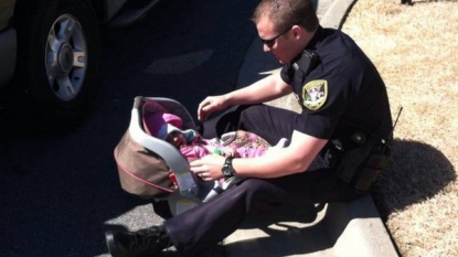 Police officer found changing diapers of a baby while on duty