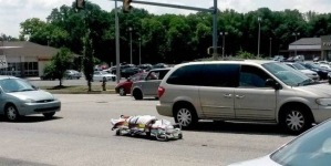 A dead body rolled out from the van in the middle of busy street