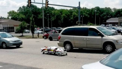 A dead body rolled out from the van in the middle of busy street