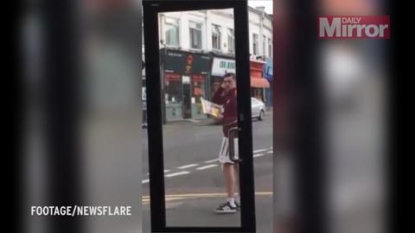 A youngster was caught presenting some Michael Jackson moves in front of mirrored shop