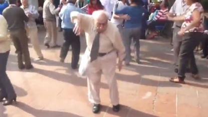 Old man threw his walking sticks to dance