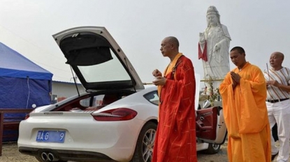 Buddhist monks takes money in exchange of blessing expensive properties