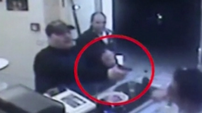 Brave pizza takeaway staff attacked on the armed robber