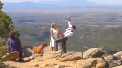 Bride saved groom from falling from the mountain on their wedding day