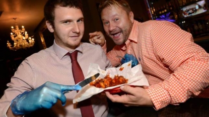 Pub offers chicken wings which are so spicy that you need to wear gloves before eating