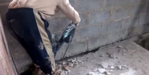 Moment when a worker fallen from concrete surface after he drilled it off