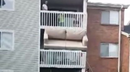 Weird but effective way to move sofa easily from second floor of house