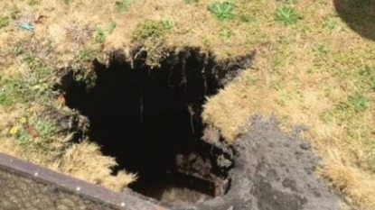 Firefighters helped out woman who was swallowed by the sinkhole