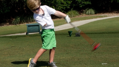 A three year old golfer can drive a ball 100 yards using just one hand