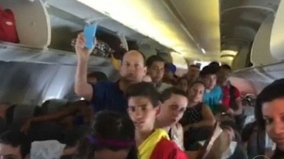 Passengers opened the emergency gate on plane after the air conditioner failed