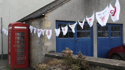 Villagers trying underpants as signboards for the speedy drivers