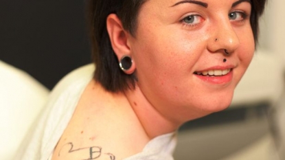 Woman gets tattoo of male private part on shoulder after a drunken party