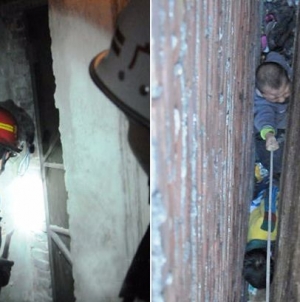 Firefighters rescued the two kid who stuck between the wall