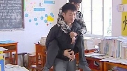 Schoolboy carries his disabled best friend on his back and travels each day to school