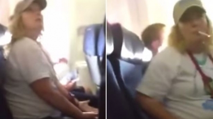 Woman lights cigarette in flight and blames the man next to her