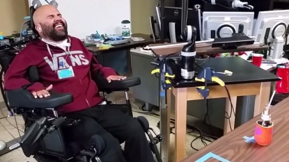 Incredible moment when a paralyzed man first time uses robotic arms in 12 years