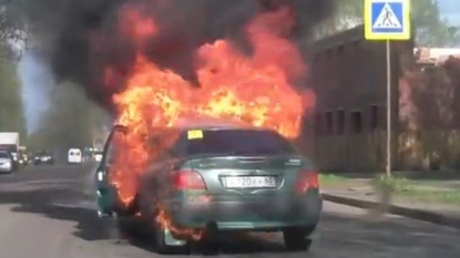 Woman left screaming after her car covered in flames