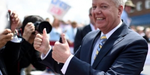 After Trump stunt, Graham sets phone on fire