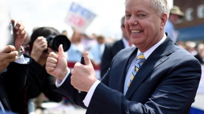 After Trump stunt, Graham sets phone on fire