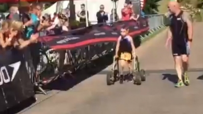 Awesome scenes as cerebral palsy sufferer, 8, completes Castle Howard Triathlon