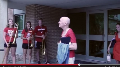 Watch A Marching Band Deliver A handsome Surprise To A Chemo Patient