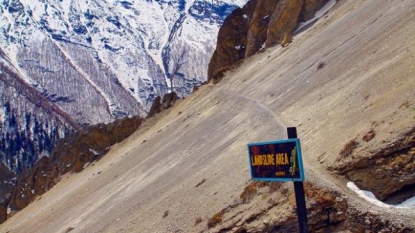 At least 16 dead, dozens missing in Nepal after landslides bury villages