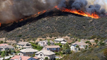 California fire that jumped Interstate 15 calms overnight