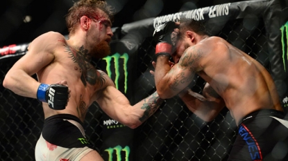 McGregor wins featherweight belt at UFC 189