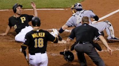 Grounds crew member swallowed up, trapped under tarp at Pirates game