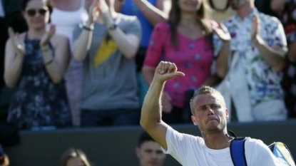 Hewitt waves goodbye after five-set thriller