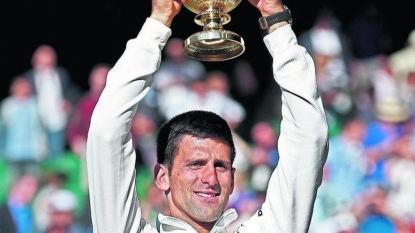 Novak Djokovic toys with Bernard Tomic on Centre Court at Wimbledon