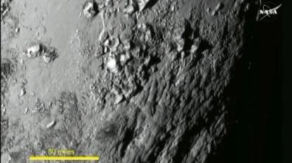 Pluto has huge mountains, Charon has canyons