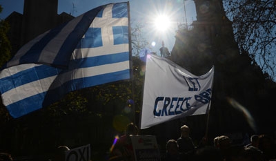 The Latest on Greece: Polls open in bailout referendum