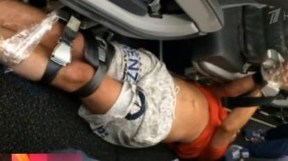 Airline passenger tied up with seatbelts and tape after drunken outburst